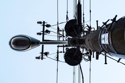 Low angle view of street light against sky