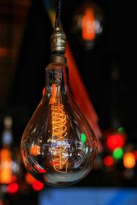 Close-up of illuminated electric bulb