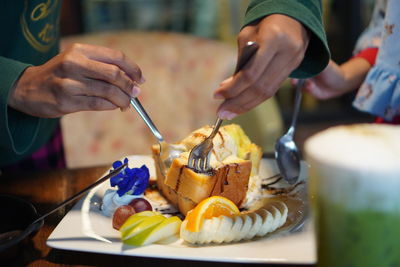 Close-up of hand holding ice cream