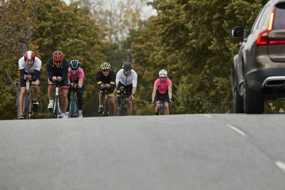 Male cyclists on country road