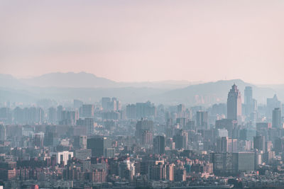 Modern buildings in city against sky