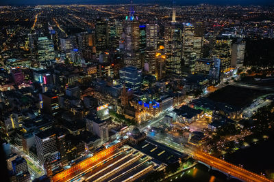 High angle view of illuminated cityscape at night