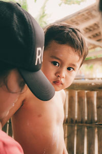 Portrait of shirtless boy looking away