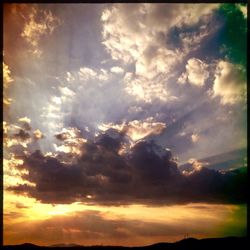 Low angle view of cloudy sky at sunset