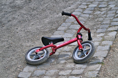 High angle view of bicycle on footpath