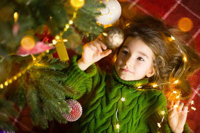 Portrait of girl with christmas tree