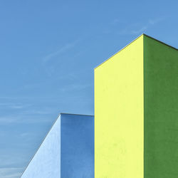 Low angle view of building against blue sky