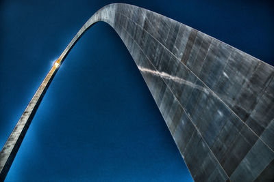 Low angle view of bridge against clear blue sky