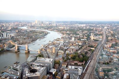 Aerial view of tower bridge over thames river amidst cityscape