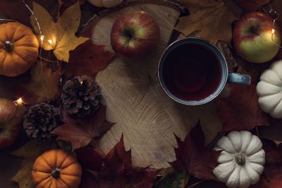 High angle view of coffee and leaves on table