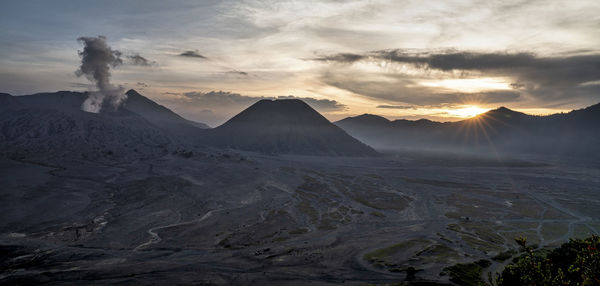 Scenic view of mountains against sky during sunset