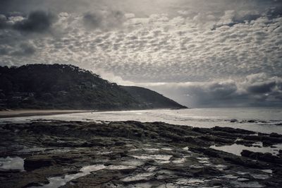 Scenic view of sea against cloudy sky