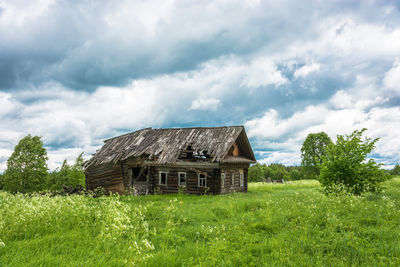 House on field against sky