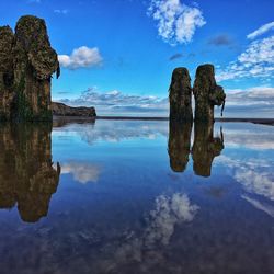 Scenic view of calm lake against sky