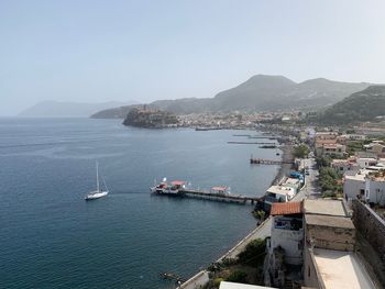 High angle view of harbor by sea against sky