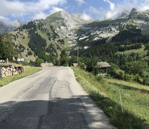 Road amidst mountains against sky