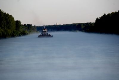 Boat on river during foggy weather