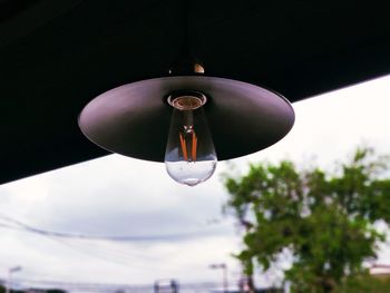 Low angle view of pendant light hanging from ceiling