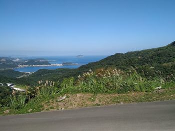 Scenic view of landscape against clear blue sky