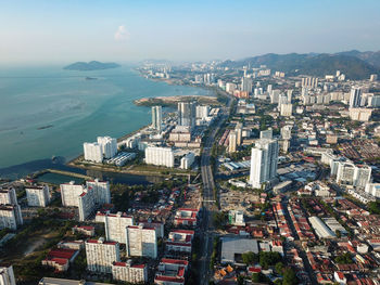 High angle view of city and buildings against sky