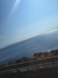 Scenic view of sea against clear blue sky