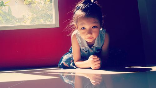 Portrait of a girl on table