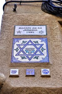 Low angle view of text on wall of building