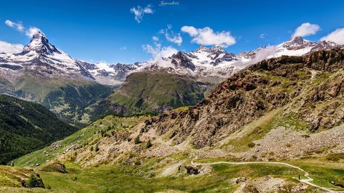 Scenic view of snowcapped mountains against sky