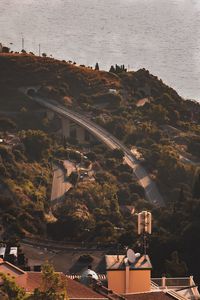 High angle view of townscape by sea against sky