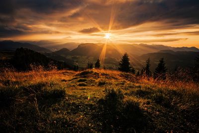 Scenic view of landscape against sky during sunset