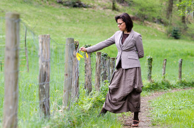 Full length of a woman standing on field