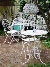 Chairs and table against trees