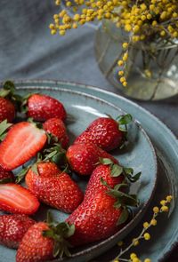 Strawberries on a plate and mimosas