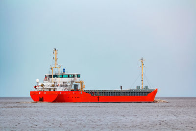 Nautical vessel on sea against clear sky