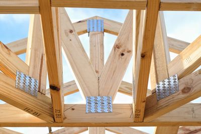 Low angle view of roof against sky