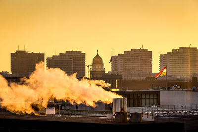 Panoramic view of cityscape against sky during sunset
