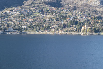 Aerial view of city by sea