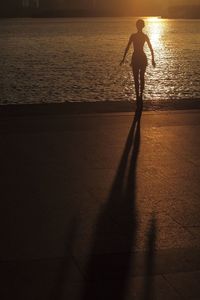 Silhouette of woman in water