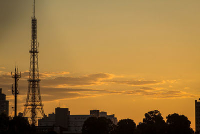 Antenna against sky during sunset