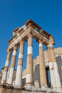 Low angle view of historical building against blue sky