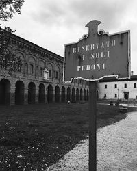 Text on building against sky