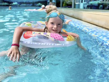 Portrait of girl in swimming pool