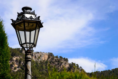 Low angle view of street light against sky