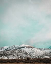 Scenic view of snowcapped mountain against sky