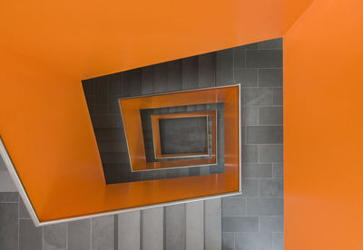 Low angle view of illuminated orange building