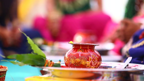 Close-up of lit candles on table