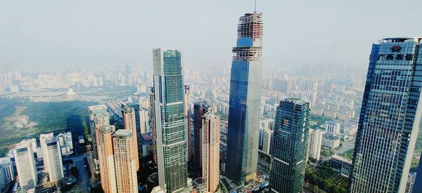 Panoramic view of buildings in city against sky