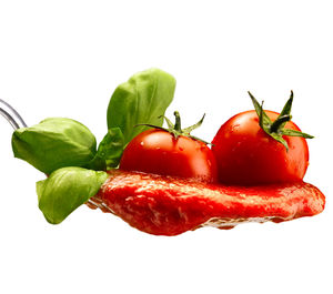 Close-up of red chili peppers against white background