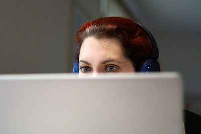 Portrait of young woman using a laptop