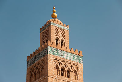 Low angle view of building against blue sky